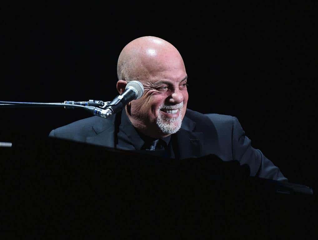 Billy Joel performing on stage.