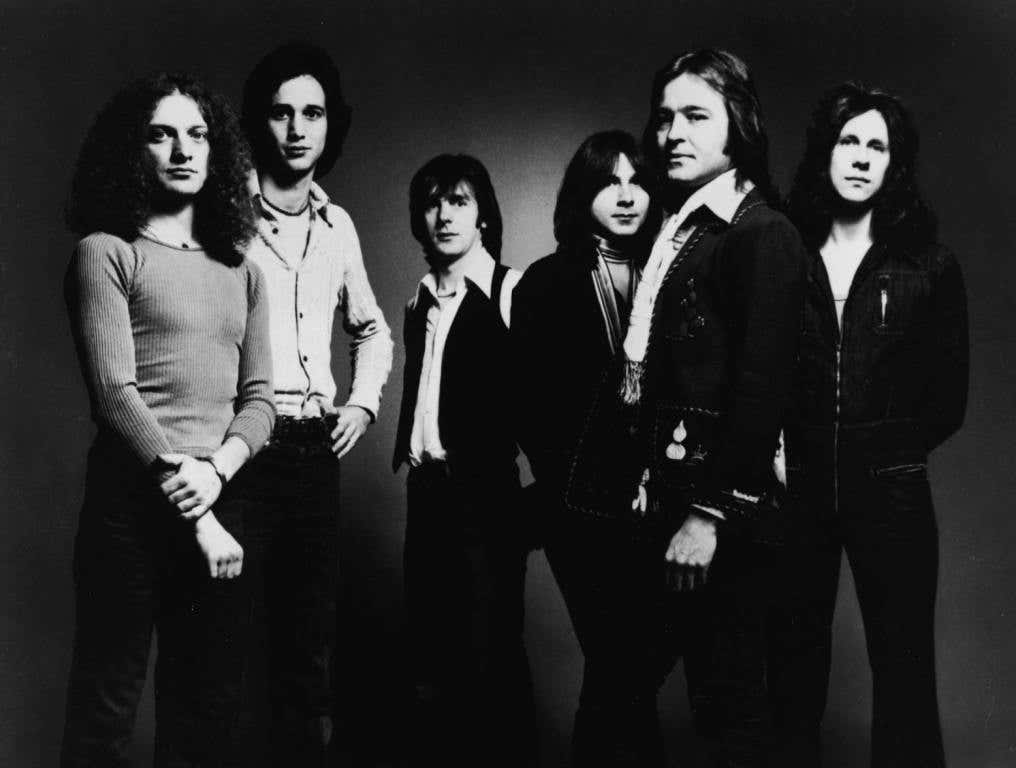 Promotional studio portrait of American rock group Foreigner, 1977. (L-R): Lou Gramm, Ian McDonald, Al Greenwood, Mick Jones, Dennis Elliot.