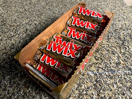 box of Twix bars on countertop