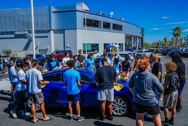 Creative Fundraisers for high school teams. Boys washing car