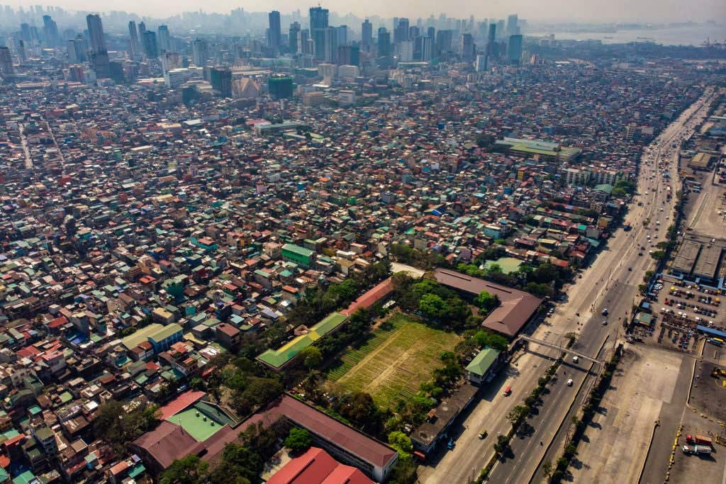 Downtown Manila in the Philippines. Did 2 Coffins Cause A Traffic Jam In The Philippines?