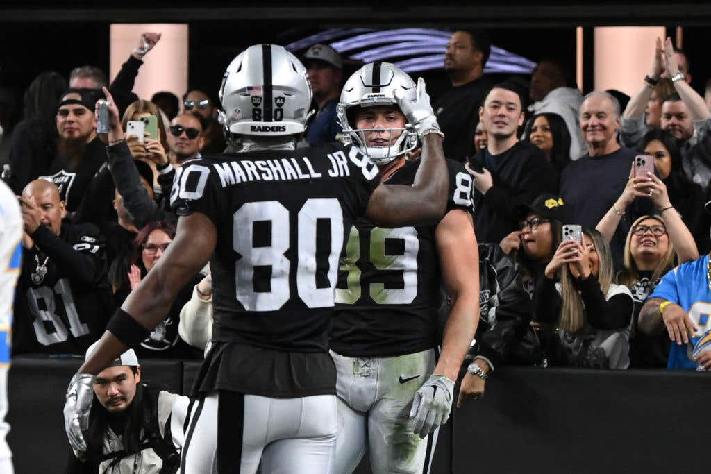 LAS VEGAS, NEVADA - JANUARY 05: Brock Bowers #89 and Terrace Marshall Jr. #80 of the Las Vegas Raiders celebrate Bowers' fourth-quarter touchdown against the Los Angeles Chargers in their game at Allegiant Stadium on January 05, 2025 in Las Vegas, Nevada. The Chargers defeated the Raiders 34-20.