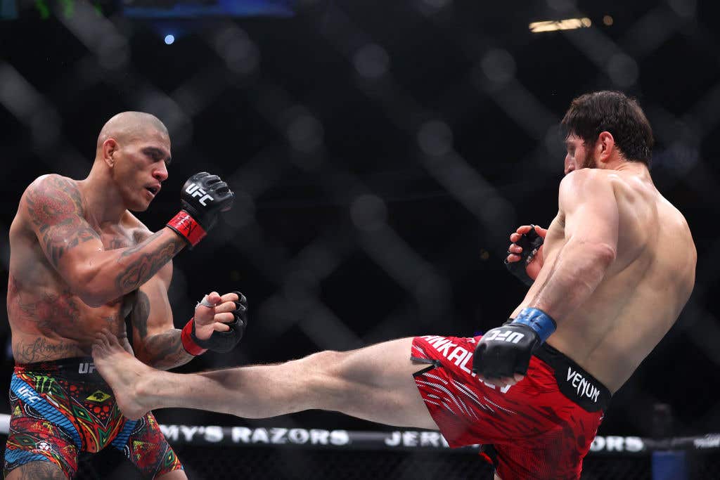 LAS VEGAS, NEVADA - MARCH 08: Alex Pereira of Brazil (L) fights Magomed Ankalaev of Russia in a Light Heavyweight Title fight during UFC 313 at T-Mobile Arena on March 08, 2025 in Las Vegas, Nevada.