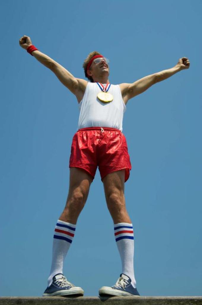 Guy in red shorts and white tank top.